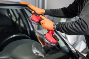 Vehicle windshield inspected for chip repair or replacement in Calgary
